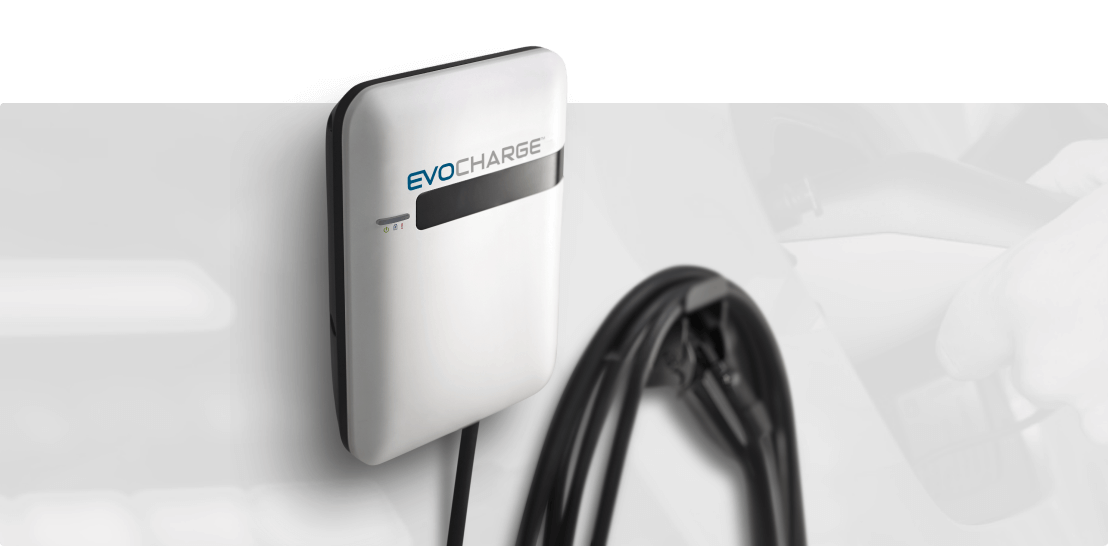 An EvoCharge charger hanging on a wall