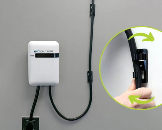 EvoCharge unit mounted to the wall and a bracket that holds a charging cord